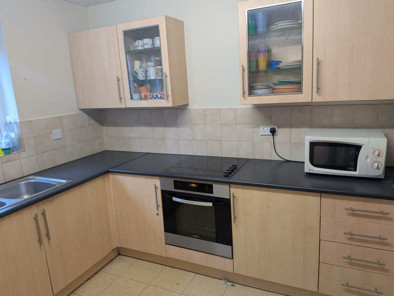 Kitchen with range of appliances
