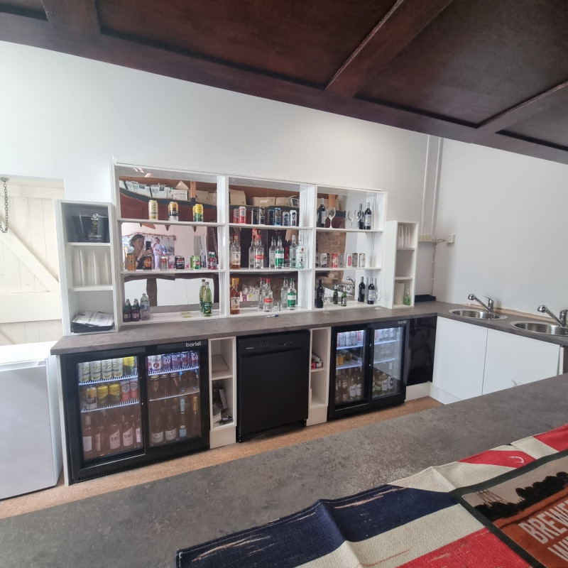 Newly refurbished bar with fridges, dishwasher and two sinks