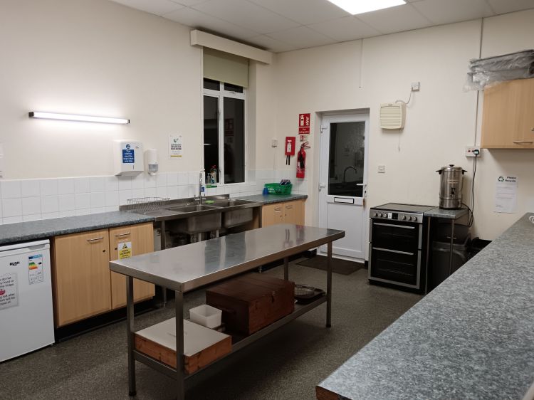 Kitchen is well equipped with fridge, double sink, freestanding cooker and plenty of work surfaces.