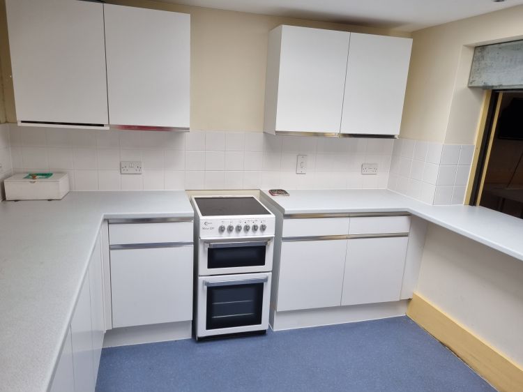 Kitchen with range of appliances