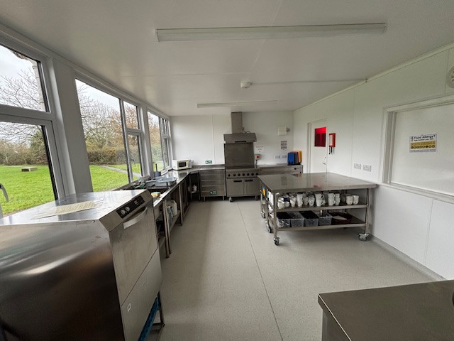 Kitchen with large range of stainless steel appliances