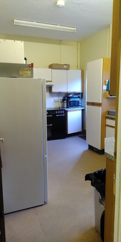 Kitchen with microwave, oven, fridge and all the crockery, cutlery and glassware you might need