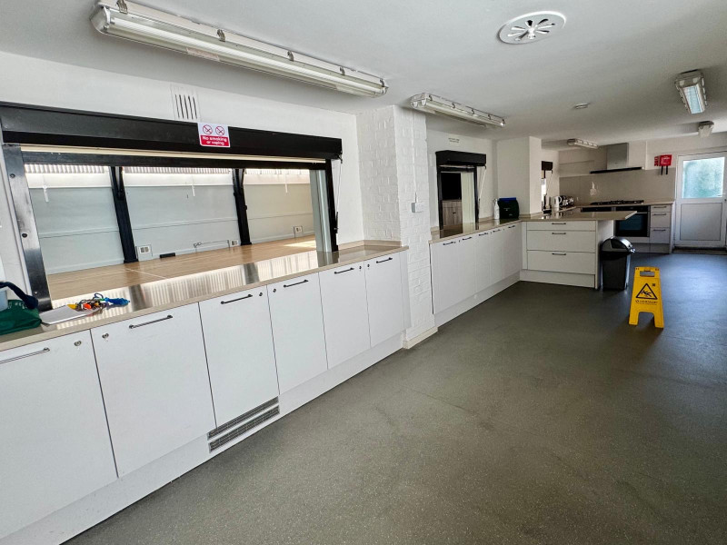 Kitchen Area with Hatch Open to Hall