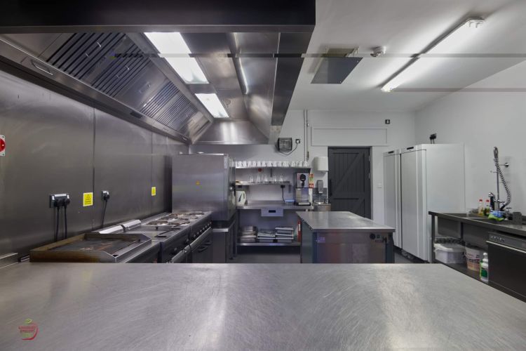 Kitchen with large range of appliances and equipment