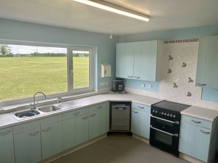 Kitchen with range of appliances