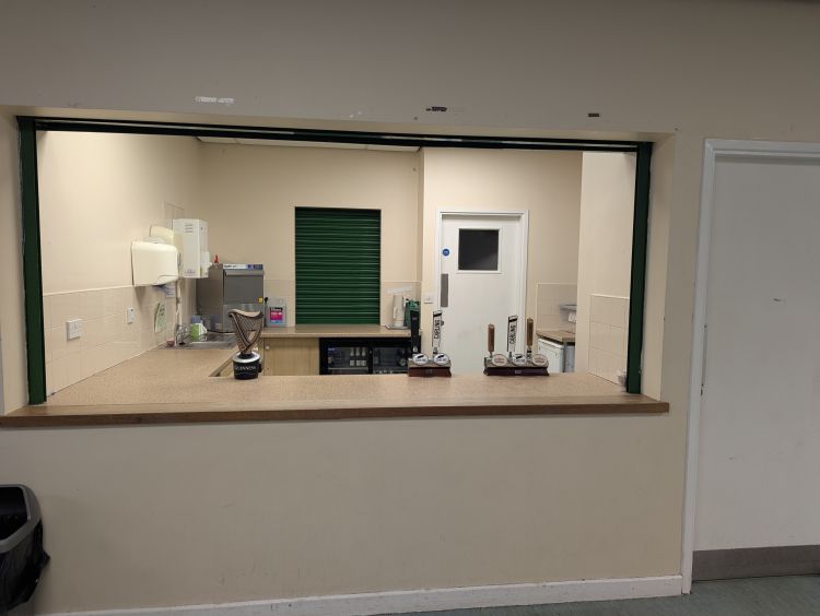 Small front kitchen & bar within the foyer area