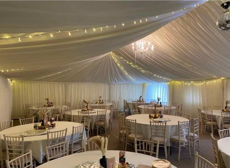 Maple Hall set up with an indoor marquee for a wedding