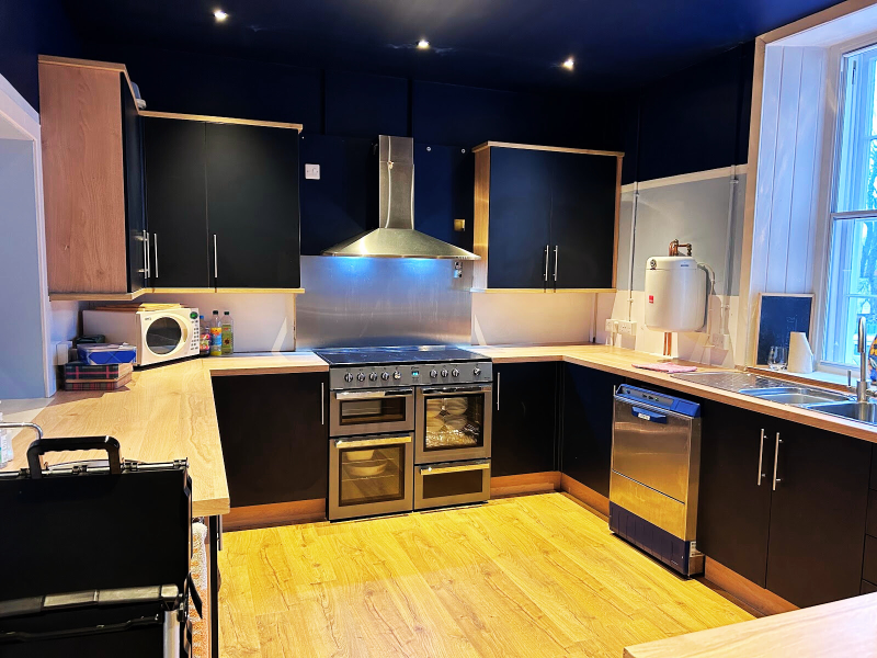 The kitchen with a range of appliances