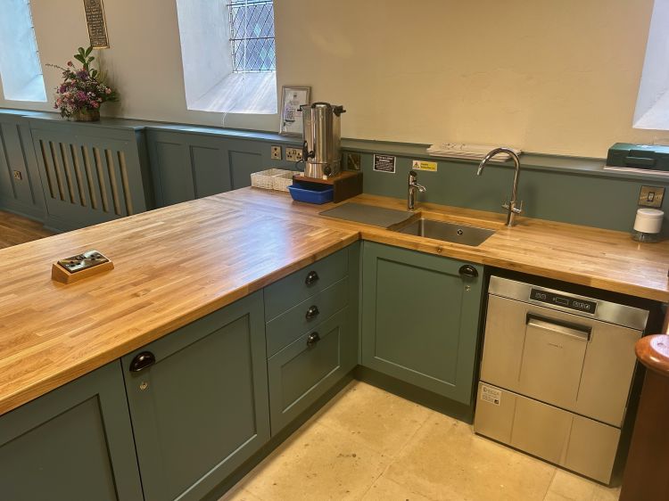 Servery- behind (with hob, microwave, hot water tap, sink, dishwasher and fridge)
