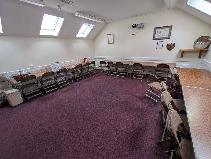 Upstairs Meeting Room - Seat up to 20 in meeting format. Projector screen available