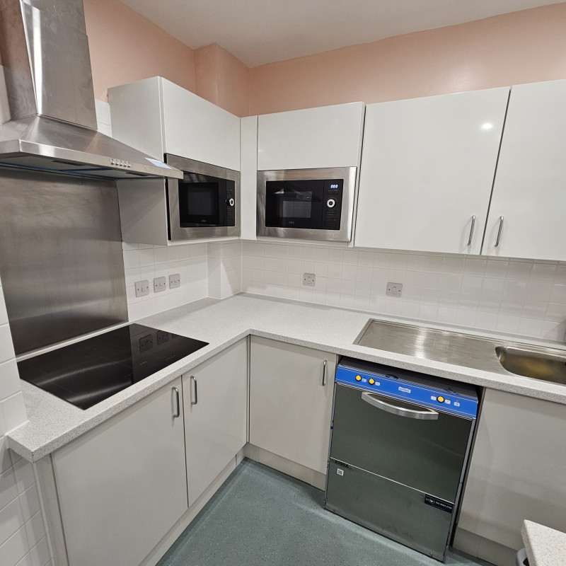 Kitchen with a range of appliances