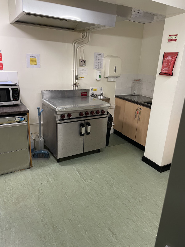 Kitchen with serving hatch to the hall